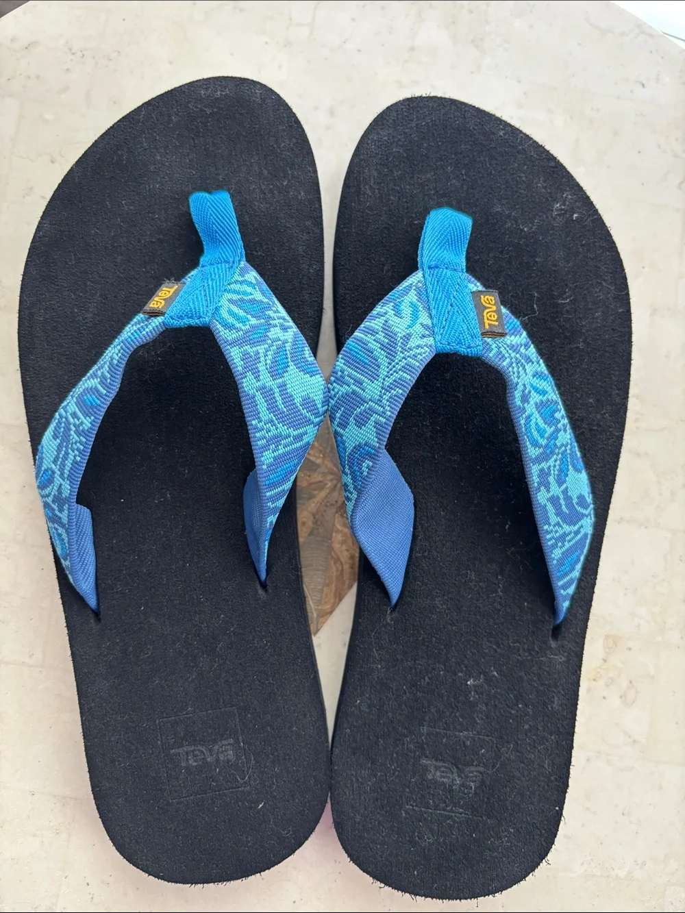 Teva Men’s Blue Patterned Strap Flip Flops with Black Footbed - size 12